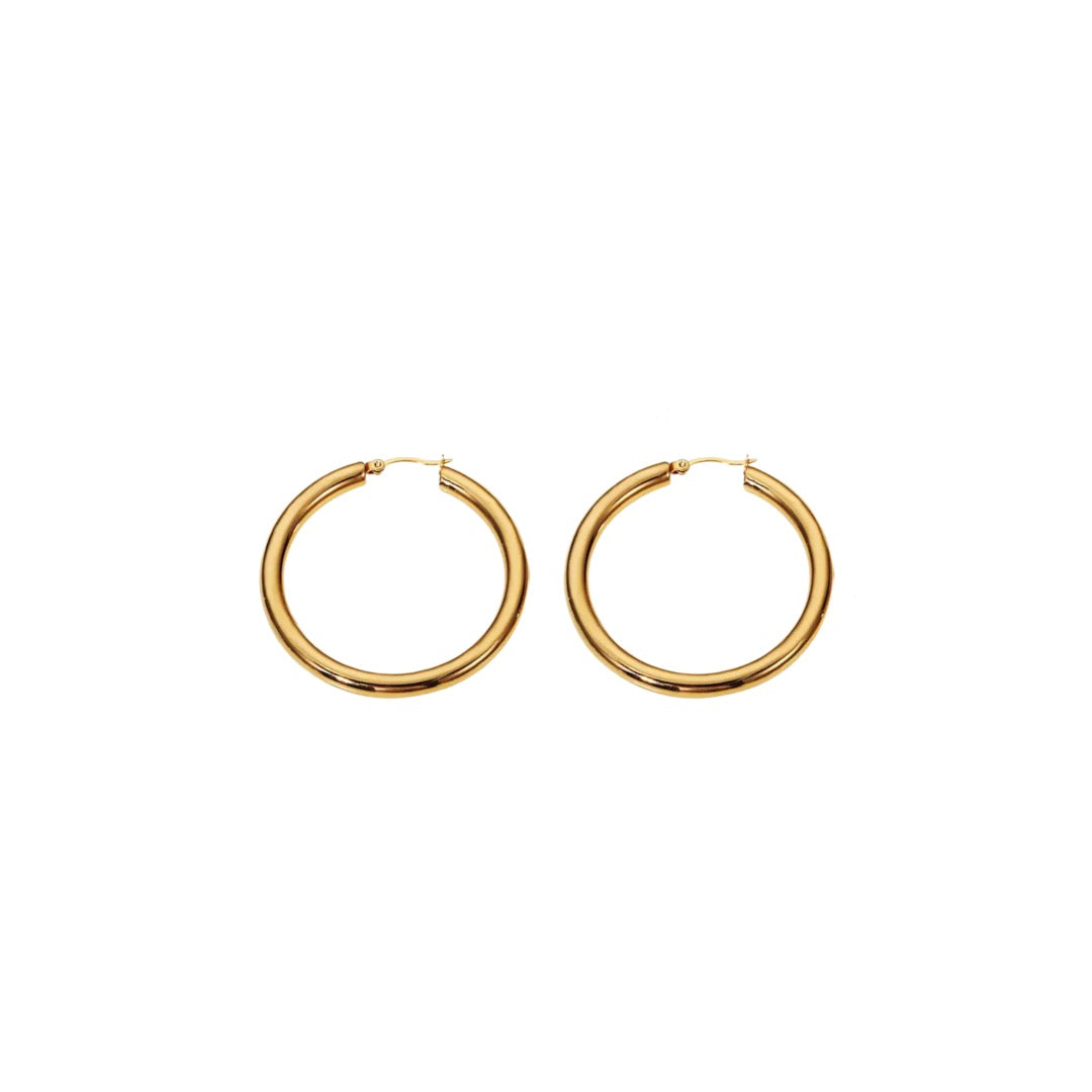 A pair of Bold Hoop Earrings made of stainless steel. Each earring has a diameter of 3cm and a thickness of 4mm, showcasing bold sophistication and modern elegance.