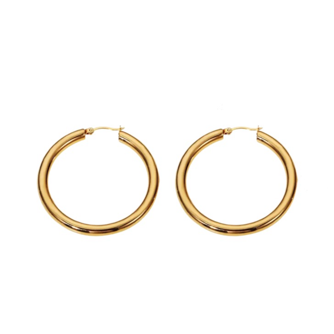 A pair of Bold Hoop Earrings made of stainless steel. Each earring has a diameter of 5cm and a thickness of 4mm, showcasing bold sophistication and modern elegance.