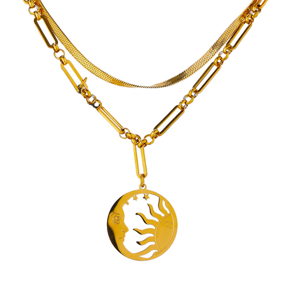 A stylish Moon and Sun Two-in-One Pendant Necklace made of hypoallergenic stainless steel with a gold finish. This elegant accessory features a 40cm snake chain and a 44cm chain, both adorned with a detailed Moon and Sun medallion. The necklace also includes a 5cm extension option, allowing for adjustable length. Designed to resist color change and oxidation, this durable and versatile piece adds a touch of celestial charm to any outfit.